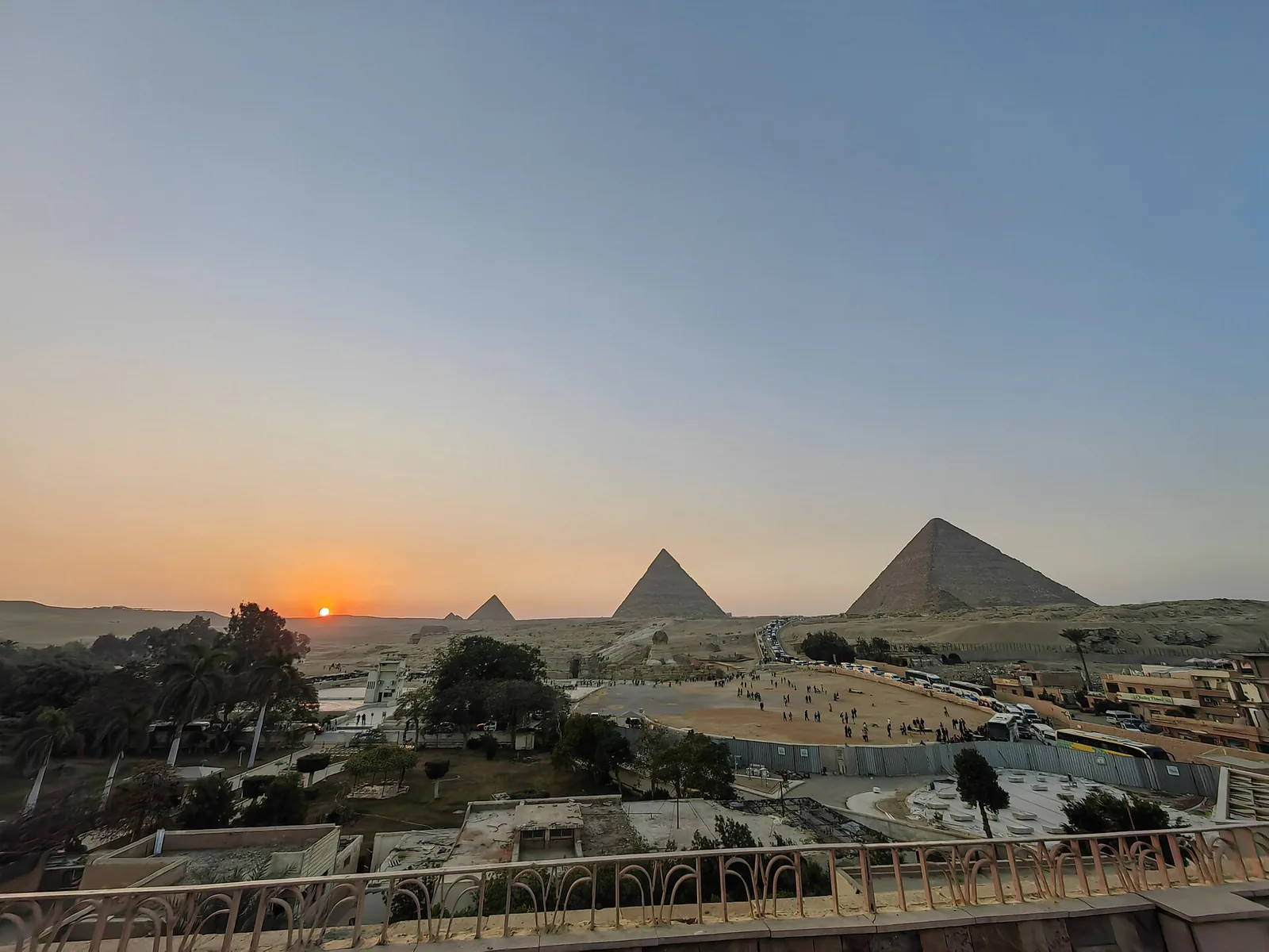 Sphinx and pyramids at Giza in golden hour light