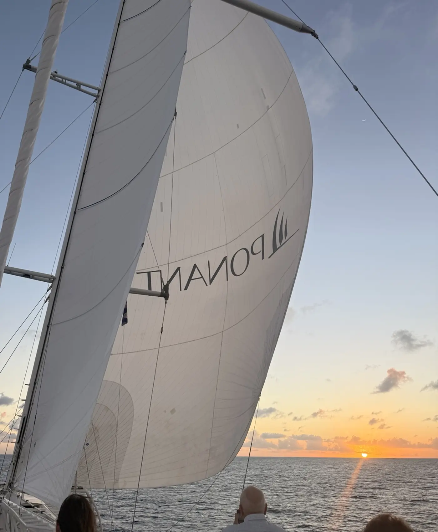 Le Ponant sails at sunset