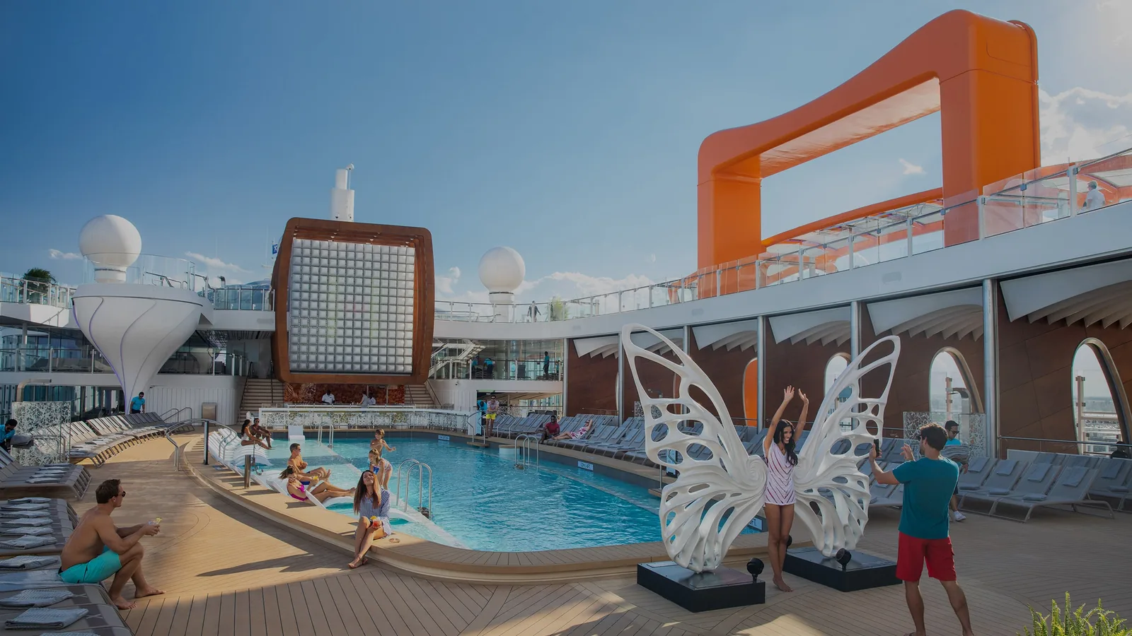 Premium design-led cruise ship pool deck at dusk