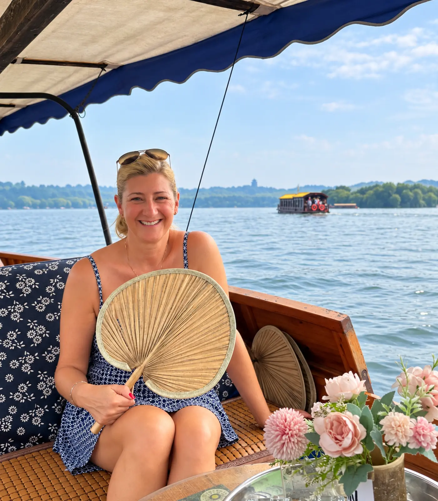 Boat ride beside lakeside flowers
